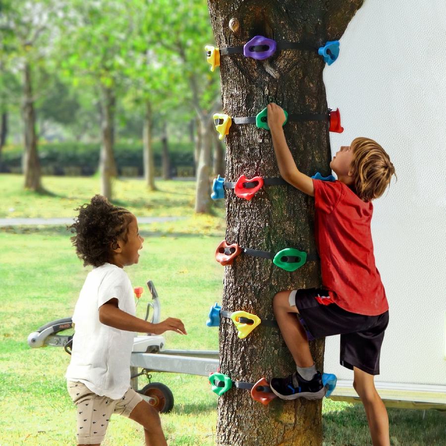 Two children at a tree trunk wrapped with TOPNEW strap-on climbing holds